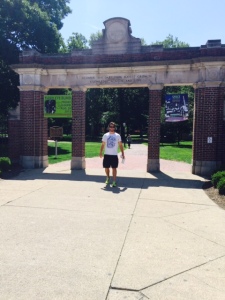 Seth standing in front of gateway of Ohio University